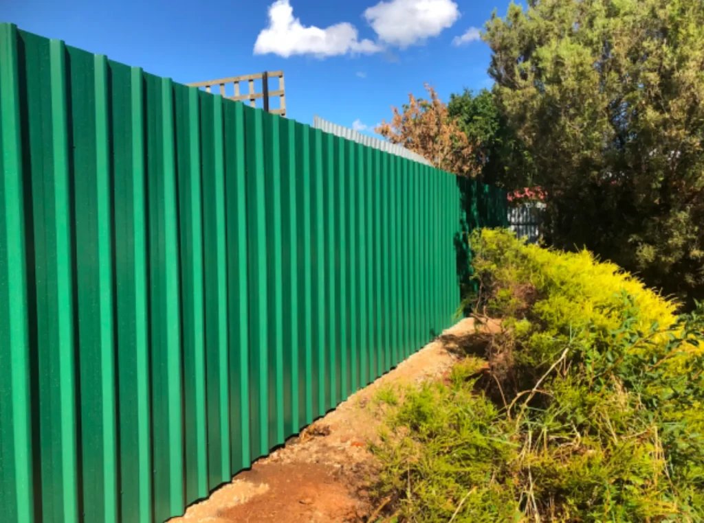 We built this Colorbond post and rail fence. Very nice!